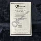 Charvel Custom Shop certificate on a textured dark background