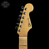 Guitar headstock with brand logo on a black background