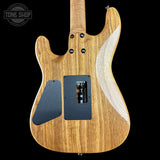 Wooden electric guitar body with visible brand logo in the corner