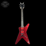 A red glitter electric guitar with a distinctive V-shaped body, set against a solid black background. The headstock features a black crescent moon logo, and a Tone Shop watermark is visible in the top-left corner.
