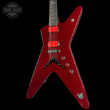 A red sparkle electric guitar with a distinctive angular V-shaped body, shown against a solid black background. The guitar features red humbucker pickups, chrome hardware, and a dark fretboard.