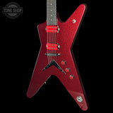 A red glitter electric guitar with a star-shaped body, shown against a solid black background. The brand logo 'TONE SHOP' is visible as an overlay in the top-left corner.