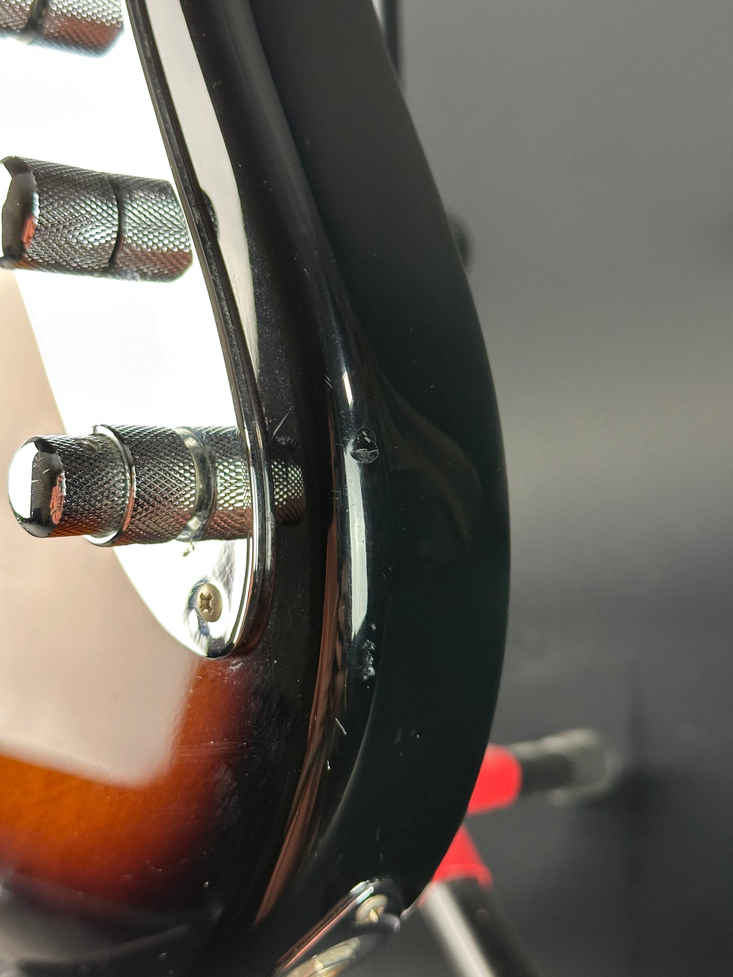 Ding on side of Used Ken Smith Proto 5 String Sunburst.