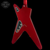 A red electric guitar body with a distinctive angular V-shaped design, shown against a solid black background. The glossy red finish has a subtle glitter texture, and the chrome hardware is visible.