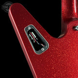 Close-up of a red glitter electric guitar body showing the rear control plate with exposed wiring, photographed against a black background. A Tone Shaping logo watermark is visible in the top-left corner.