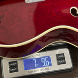Used 2012 Gretsch G6119 Chet Atkins Tennessee Rose on scale displaying weight.