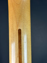 Wooden paddle with a white stripe on a black background