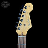 Headstock of Used 2015 Fender American Standard RW Mystic Red.