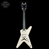 An electric guitar with a cream-colored body and a black neck, shown against a solid black background. A Tone Shop watermark is visible in the top-left corner.