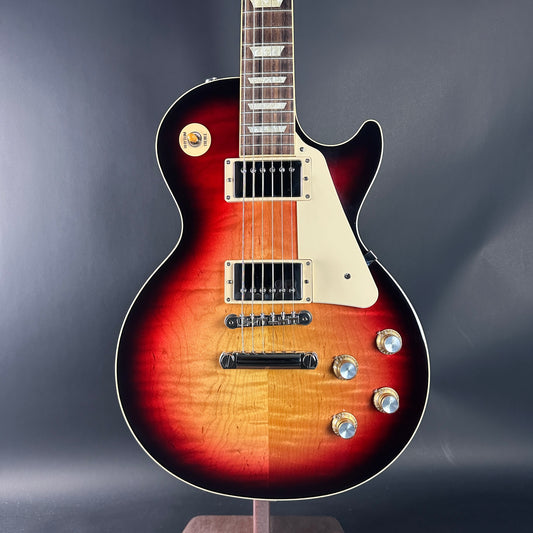 Electric guitar with a sunburst finish on a dark gray background