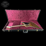 Guitar in a pink case with 'Tone Shop' logo in the corner