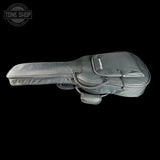 A dark gray nylon guitar or bass instrument bag with a zippered main compartment and a front pocket, shown against a solid black background. A Tone Shop watermark is visible in the top-left corner.