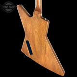 Wooden guitar body with 'Tone Shop' logo in the corner