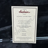 Jackson Custom Shop document on a guitar body