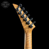 Close-up of a guitar neck with tuning pegs on a black background, featuring the Tone Shop logo.