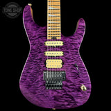 Purple electric guitar with a wavy finish on a black background, featuring the Tone Shop logo.