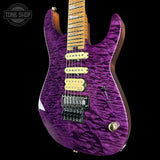 Purple electric guitar with a wavy finish on a black background, featuring the Tone Shop logo.