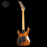 Wooden electric guitar with a black background, featuring the Tone Shop logo.