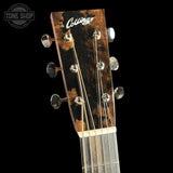 Guitar headstock with 'Collings' logo on a black background