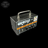Orange VOICED DUCK 200W guitar amp head in black with orange accents, featuring a silver handle and four control knobs, shown on a black background.
