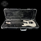 Guitar case with a guitar inside, featuring a 'Tone Shop' logo.
