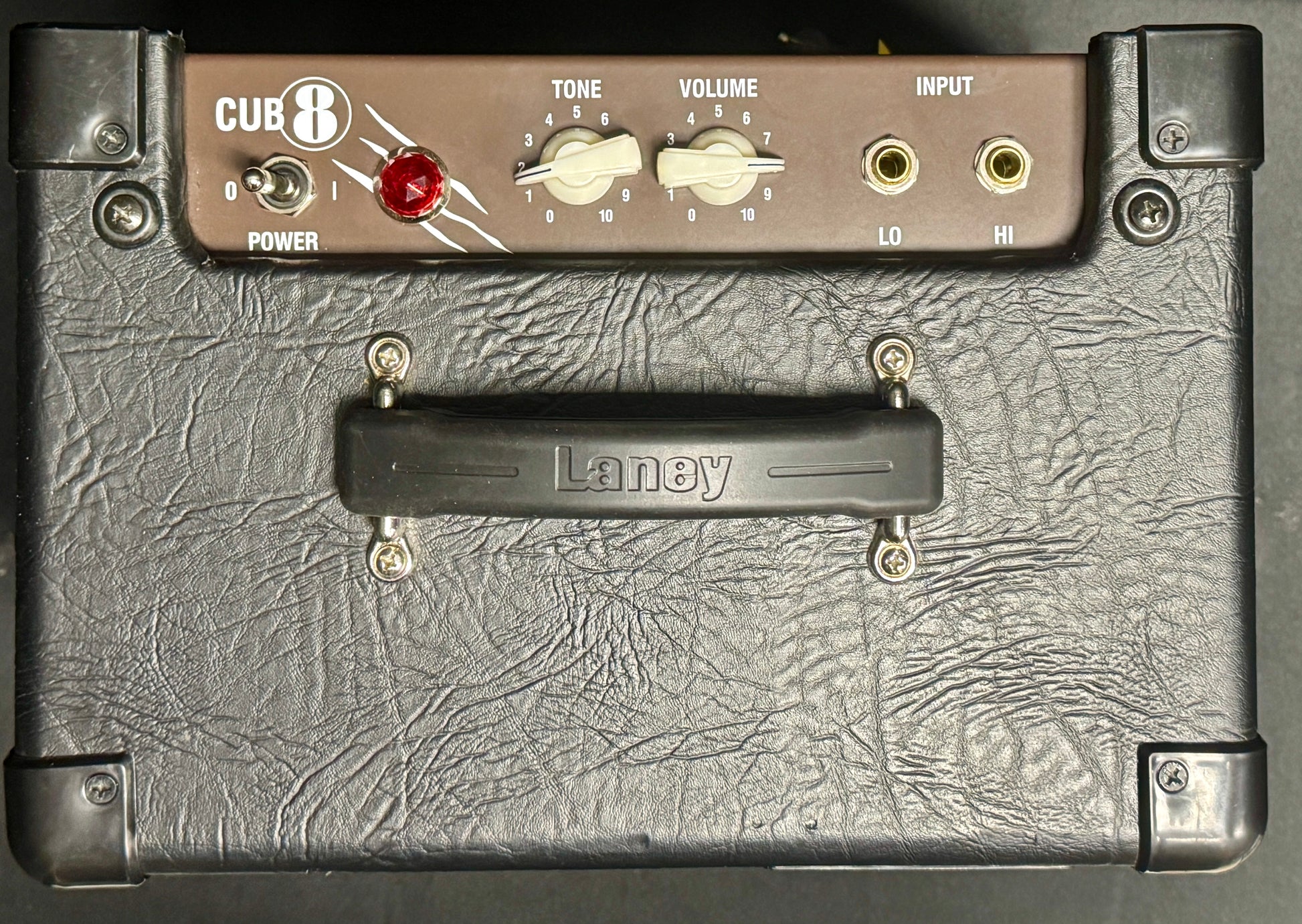 Guitar amplifier with 'Cub' branding on a textured surface