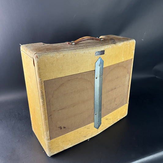 Vintage guitar amplifier cabinet with a dark background