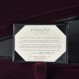 Certificate of authenticity for a C.F. Martin & Co. guitar on a dark background