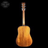Wooden acoustic guitar on a black background with 'Tone Shop' logo.