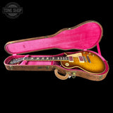 Gibson Les Paul guitar in a pink case with 'Tone Shop' logo.