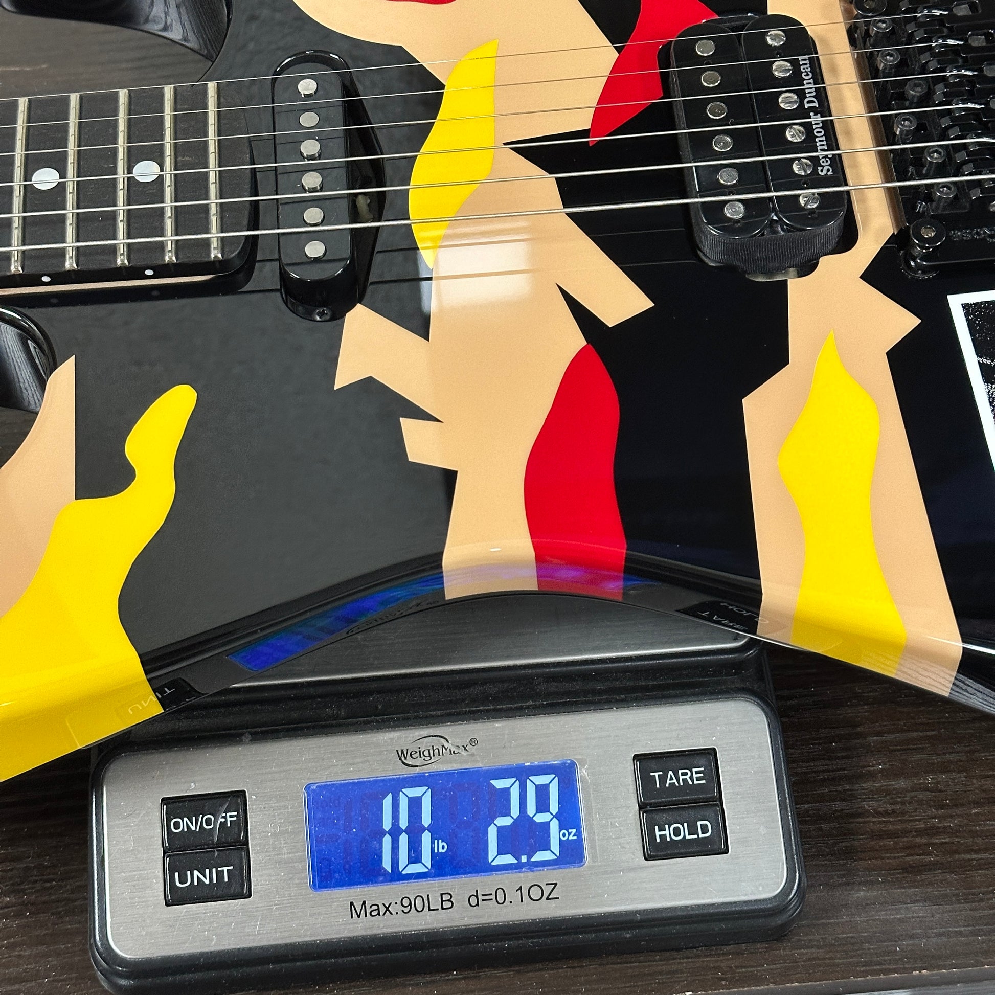 Closeup of ESP Original Series George Lynch Kamikaze 1 w/case E2580242 on a scale weighing 10 lbs 2.9 oz