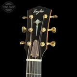 Taylor guitar headstock with brand logo on a black background