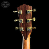 Guitar headstock with Taylor tuning pegs on a black background