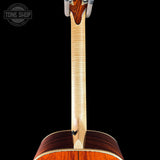 Close-up of a guitar's wooden neck and body on a black background with 'Tone Shop' logo.
