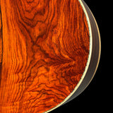 Close-up of a wooden surface with intricate grain patterns on a black background