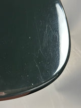 Scratched surface of a metallic object with a blurred background