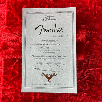 Fender certificate of authenticity on a red textured background