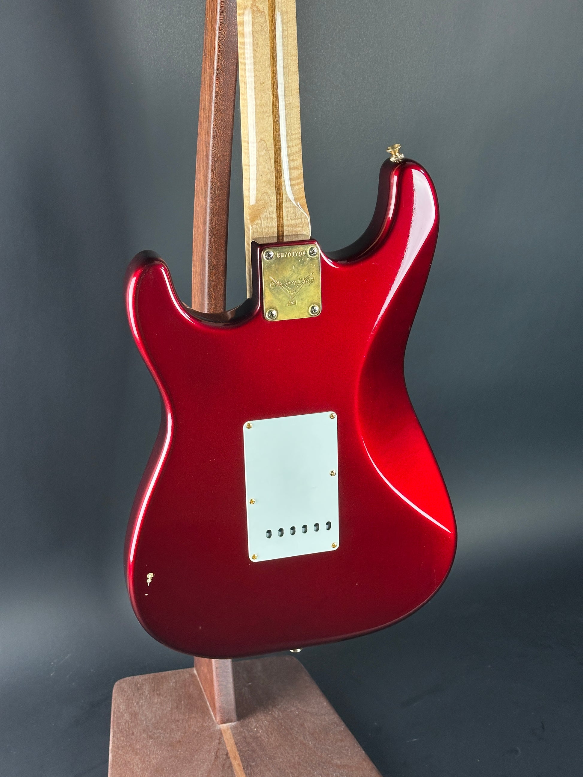 Red electric guitar on a dark gray background