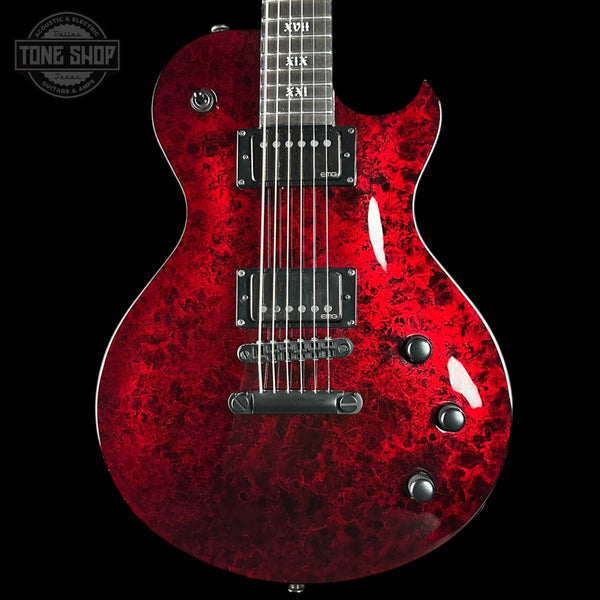 Red electric guitar with a black background