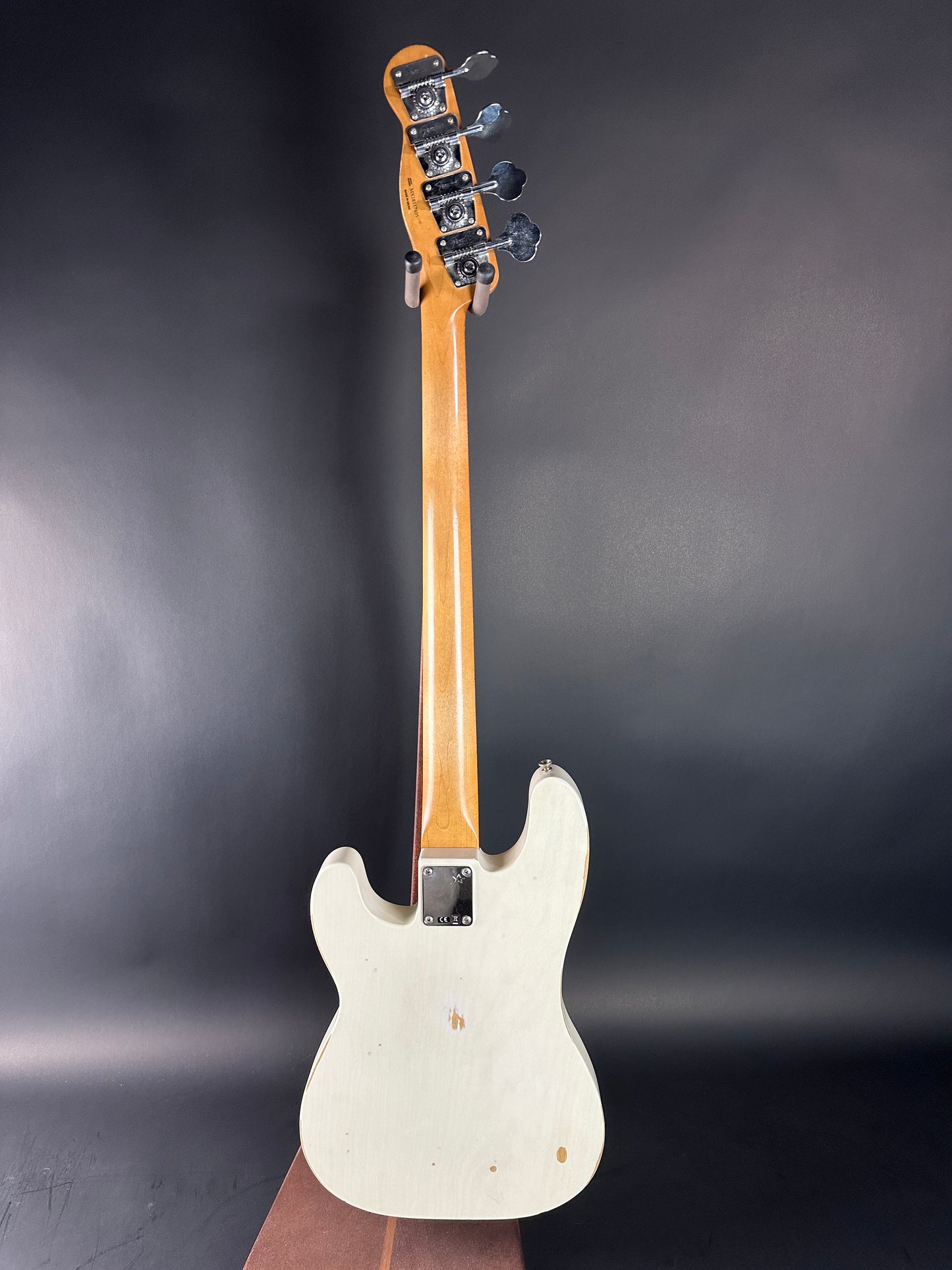 White electric guitar on a dark gray background