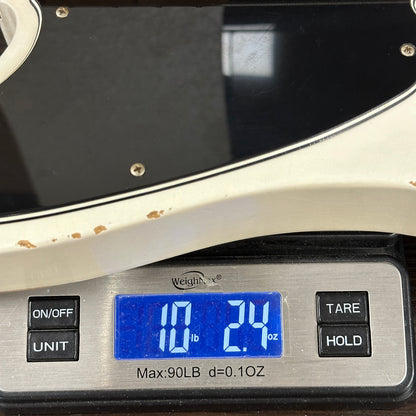 Digital kitchen scale displaying weight with a blue digital readout.