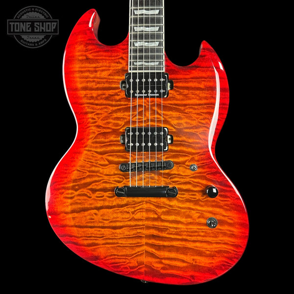 Red electric guitar with a wavy wood grain pattern on a black background, featuring the Tone Shop logo.