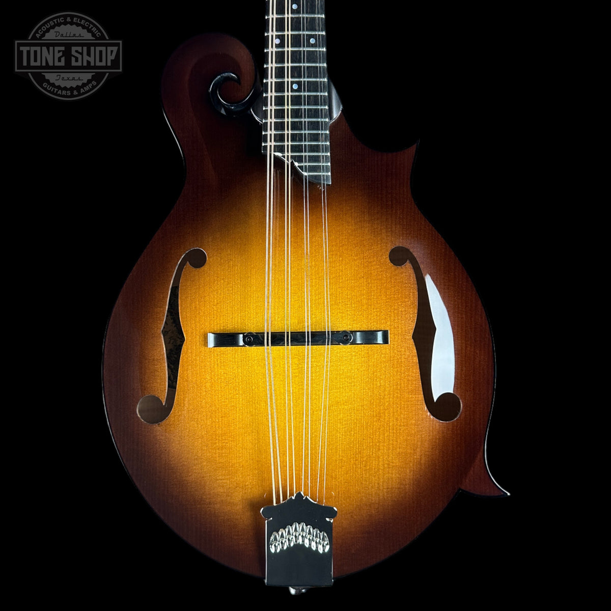 Wooden mandolin with a dark background and 'Tone Shop' logo.