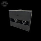 A black metal speaker cabinet with two visible BlackCat speakers, shown at an angle against a solid black background. A Tone Shop watermark is visible in the top-left corner.