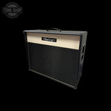 A Bad Cat 3x10 guitar amplifier cabinet with a black textured grille, cream-colored top panel, and black side casing, shown on a solid black background with a Tone Shop watermark in the upper left.