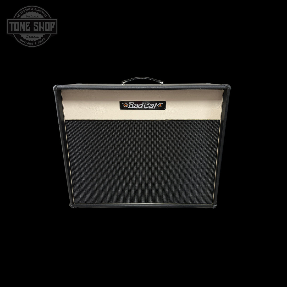 A Bad Cat guitar amplifier cabinet with a black grille and a cream-colored top panel, shown against a solid black background with a Tone Shop watermark in the upper left corner.