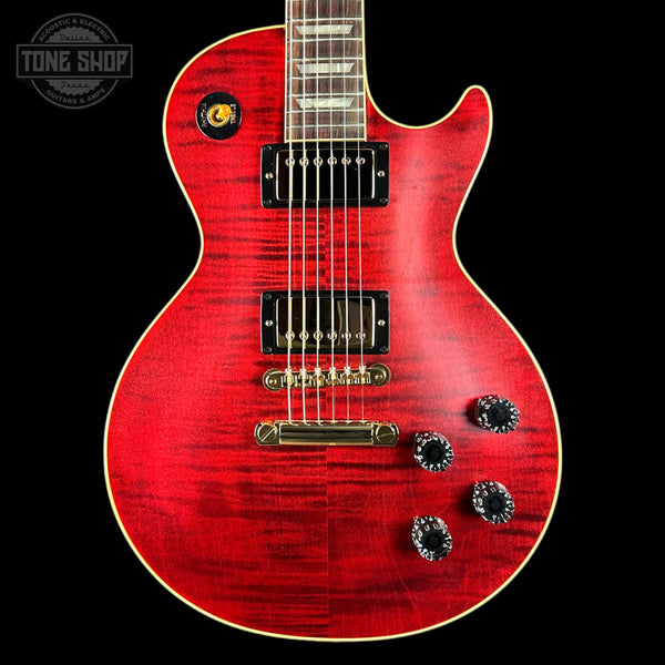 Red electric guitar with a black background