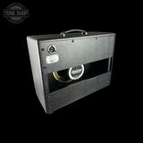 Guitar amplifier with 'Bad Cat' speaker on a black background, featuring the Tone Shop logo.
