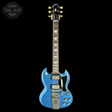 Blue electric guitar on a black background with 'Tone Shop' logo.