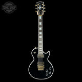 Electric guitar with a black finish on a white background